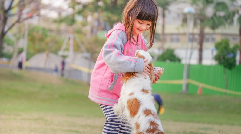Portrait of a Smiling Young Woman With Dog