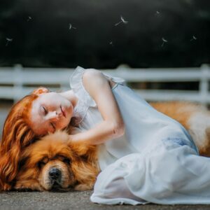 Girl and Dog Sleeping on Gray Pavement